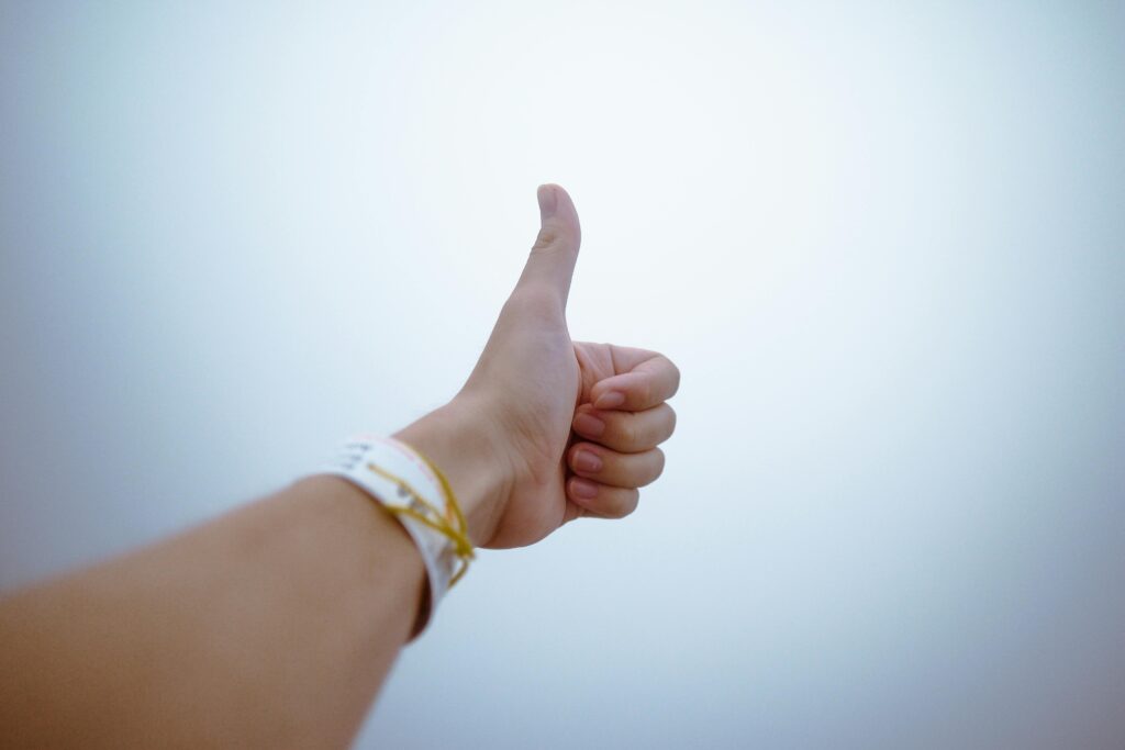 pexels-photo-193821-193821 A hand giving a thumbs up gesture symbolizes approval and positivity.